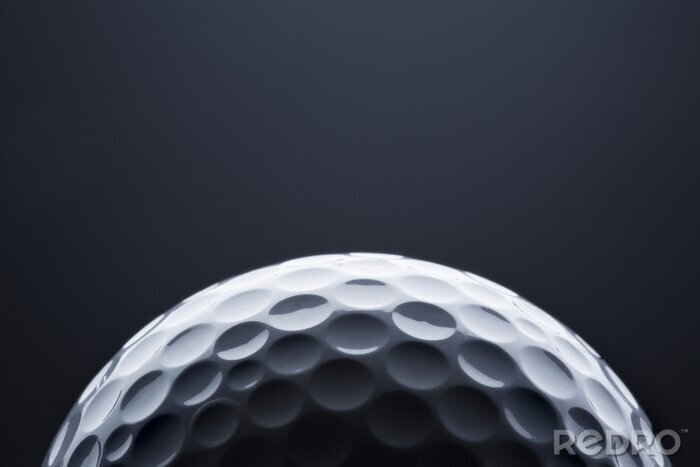Sticker  Macro golf ball on dark blue  background, space for text.