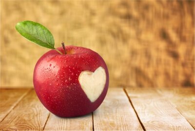 Sticker  Pomme rouge sur une table en bois