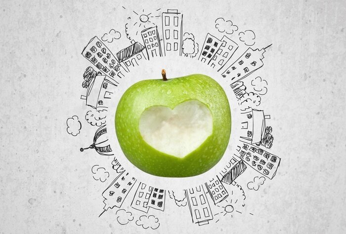 Sticker  Pomme verte entourée de bâtiments