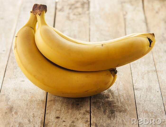 Sticker  Régime de bananes sur des planches marron clair