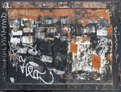 Sticker  rusty and damaged metal square with frame, graffiti and old stickers peeled off