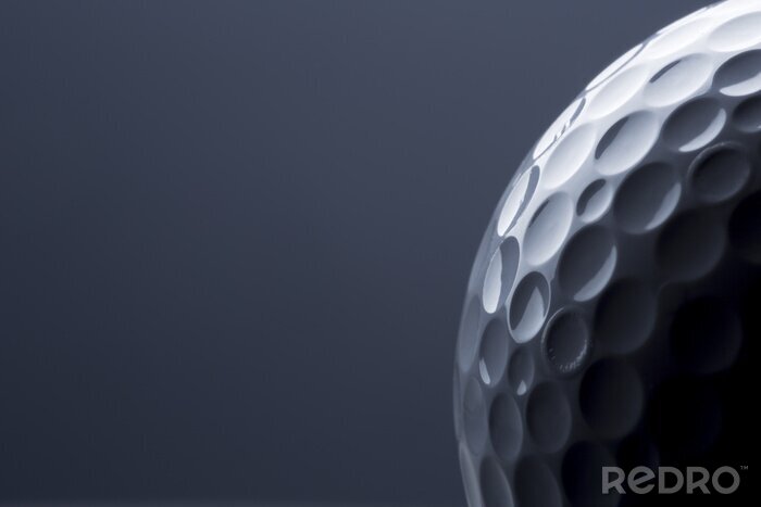 Sticker  Stylish golf ball isolated on empty dark blue background.