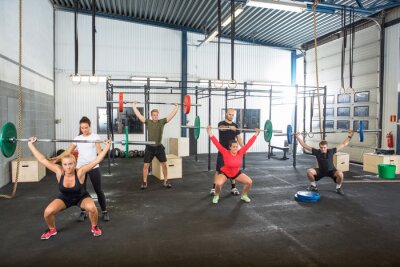 Sticker  Trainers Assisting Athletes In Exercising With Barbells