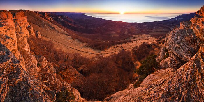 Tableau  aerial view of mountain hills and sunrise above the sea