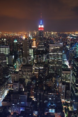 Tableau  Aerial view of New York City at night with Empire State building in the center.
