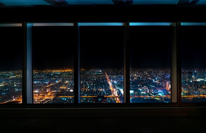Tableau  Aerial view of the Osaka skyline at night through a skyscraper window