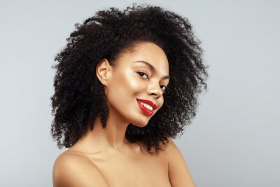 Tableau  African American Fashion Model portrait. Brunette curly haired young woman. Beauty salon and haircare concept.