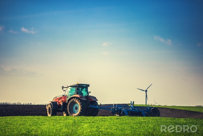 Tableau  Agriculteur avec tracteur ensemencement des champs au champ