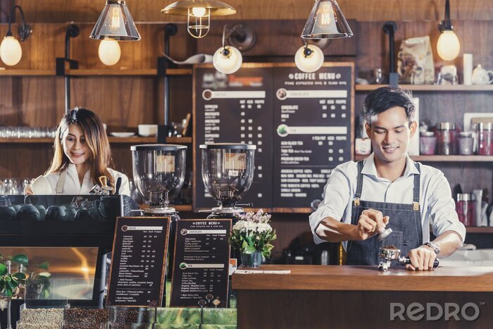 Tableau  Asian Barista preparing cup of coffee, espresso with latte or cappuccino for customer order in coffee shop,bartender pouring milk,Small business owner and startup in coffee shop and restaurant concept