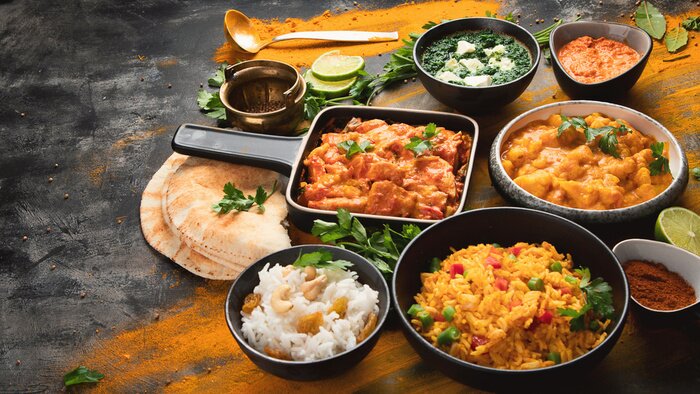 Tableau  Assorted indian food on black background..