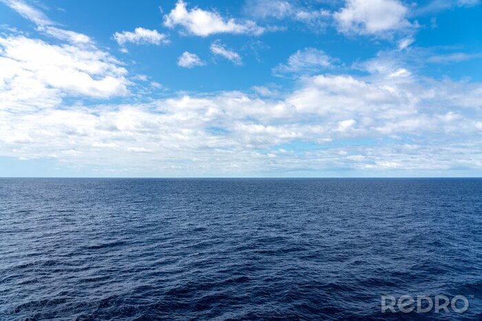 Tableau  Atlantic Ocean Seascape with blue ocean and a sky filled with clouds 