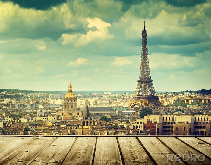 Tableau  background with wooden deck table and Eiffel tower in Paris