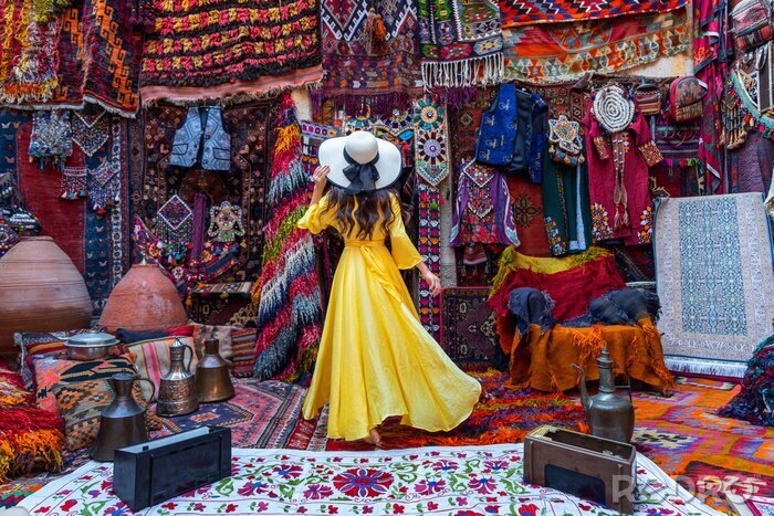 Tableau  Beautiful girl at traditional carpet shop in Goreme city, Cappadocia in Turkey.