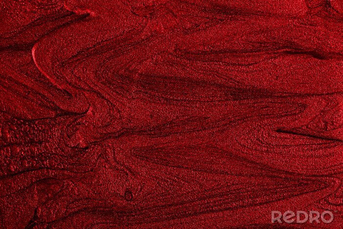 Tableau  Beautiful stains of liquid nail polish,fluid art technique.Bright red marble background.Liquid stripy paint texture.Nail laquer flow modern backdrop.Minimalistic concept.Copy space for design.
