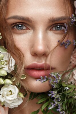 Tableau  Beautiful woman with classic nude make up, light hairstyle and flowers. Beauty face.
