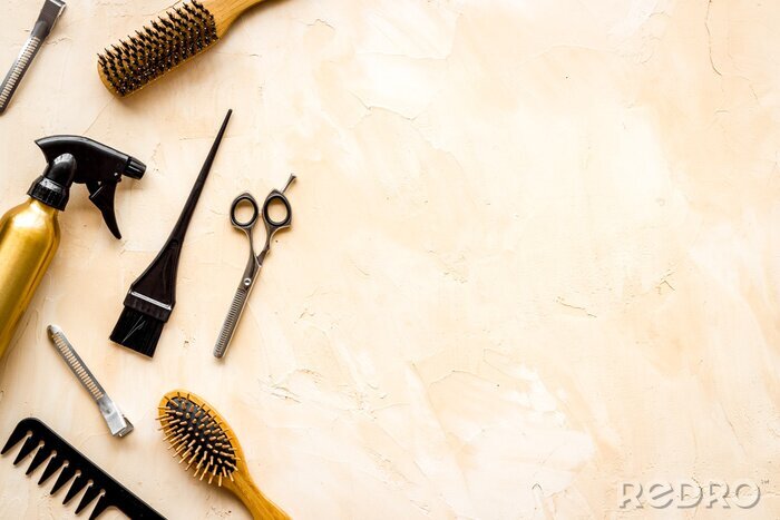 Tableau  Beauty saloon accessories - combs, sciccors for hairdressing - on beige background top-down frame copy space
