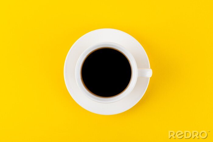 Tableau  Black coffee in a cup on a yellow background