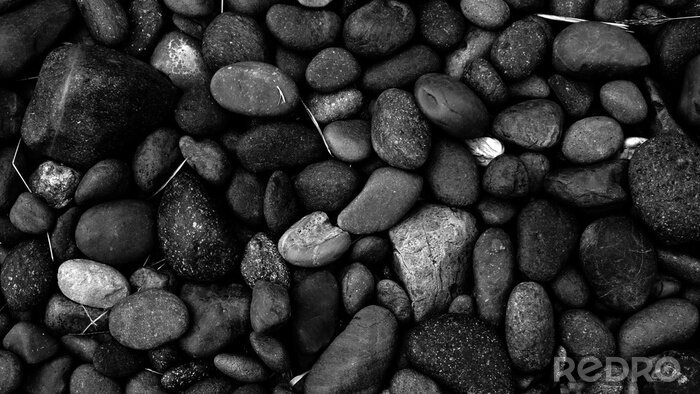 Tableau  black stone background, pebble beach stone floor