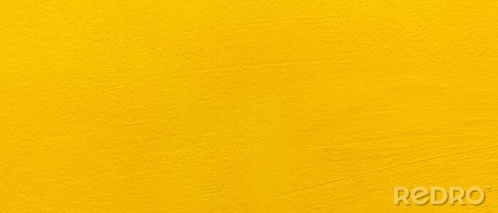 Tableau  Blurred Yellow stucco wall background. Yellow painted cement wall texture.