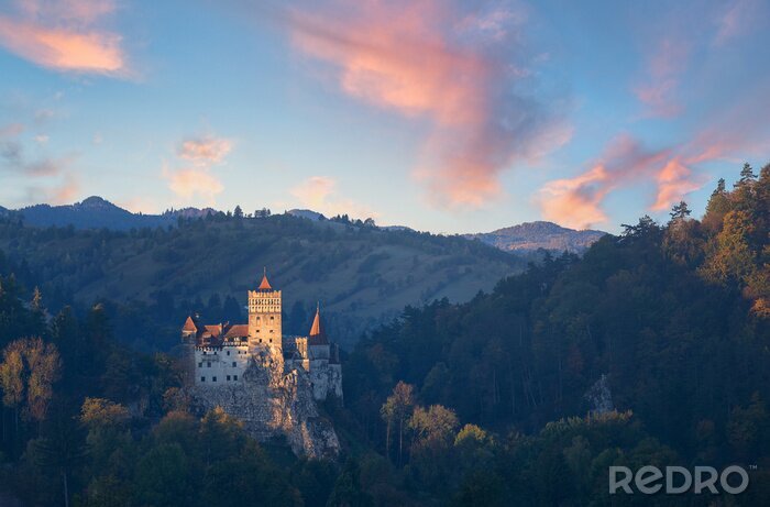 Tableau  Bran or Dracula Castle in Transylvania, Romania. The castle is located on top of a mountain,