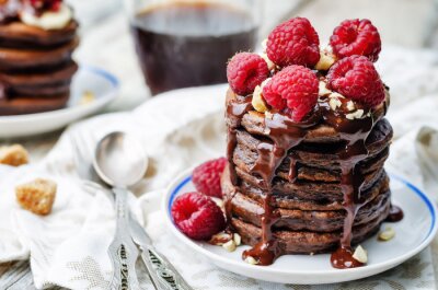 Tableau  chocolate pancake with bananas, raspberries, nuts and chocolate