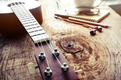 Tableau  Close up of ukulele on old wood background with soft light