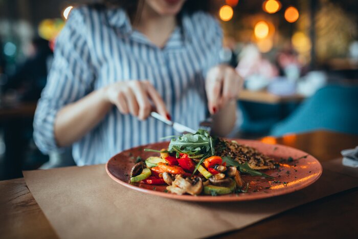 Tableau  close up of woman in restaurant eating