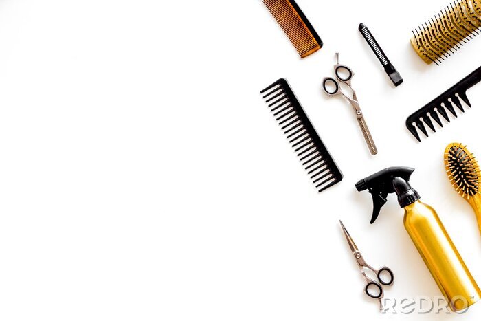 Tableau  Combs, spray and hairdresser tools in beauty salon work desk on white background top view mockup
