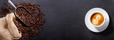 Tableau  cup of coffee and coffee beans in a sack, top view