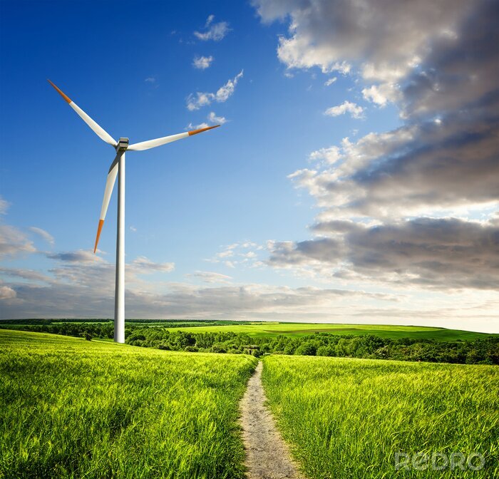 Tableau  Des champs verts et un moulin à vent moderne