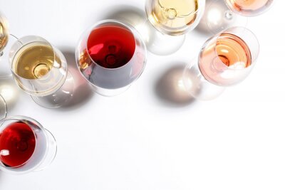 Tableau  Different glasses with wine on white background, top view