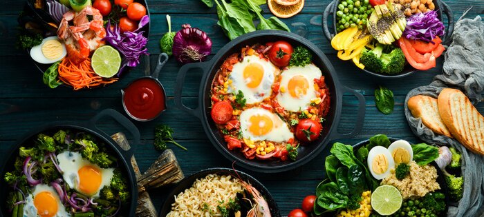 Tableau  Dishes background. Set of dishes on the dining table. Food. Traditional cuisines of the world. Top view. Free space for your text.