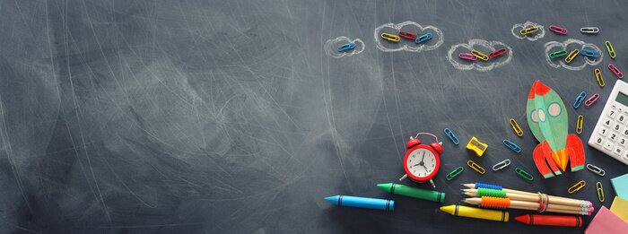 Tableau  education. Back to school concept. rocket cut from paper and painted over blackboard background. top view, flat lay. banner