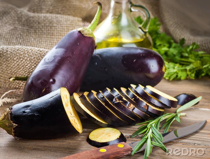 Tableau  Eggplant and olive oil on a wooden board