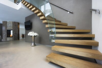 Tableau  elegant wood and glass staircase in luxury home