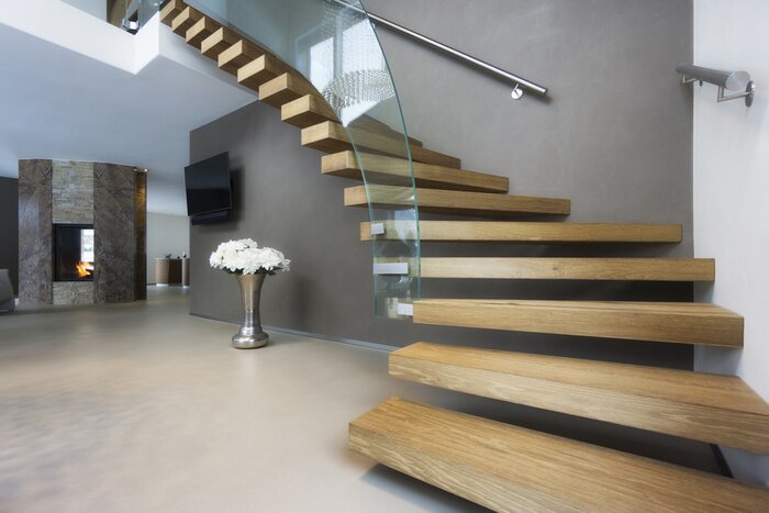 Tableau  elegant wood and glass staircase in luxury home