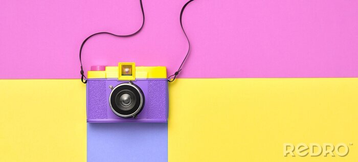 Tableau  Fashion film camera. Minimal hipster summer trend flat lay. Retro design camera on vivid color. Summertime concept. Trendy fashionable film camera, creative pop art
