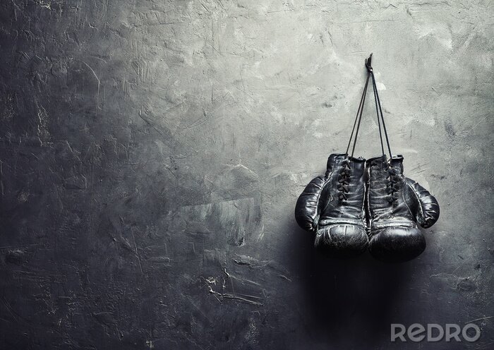 Tableau  Gants de boxe noirs sur un mur en béton gris