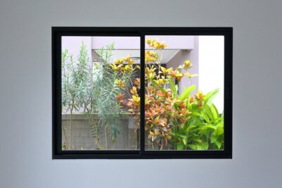 Tableau  glass slide window replacement on white wall of a new house