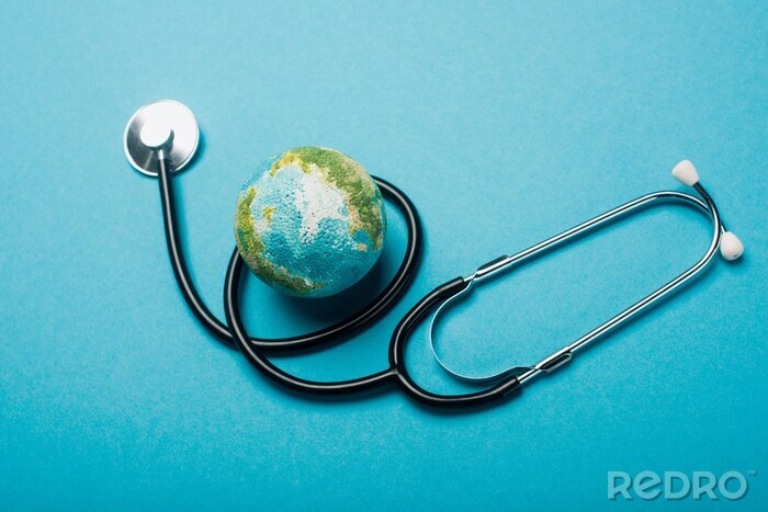 Tableau  Globe and stethoscope on blue background, world health day concept