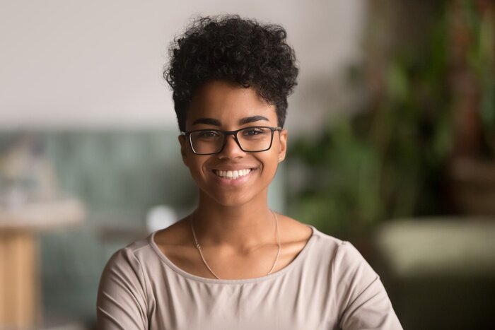 Tableau  Headshot portrait of happy mixed race african girl wearing glasses