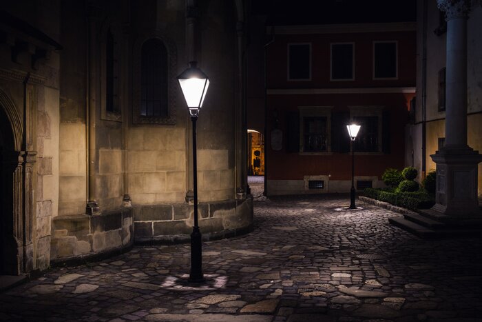 Tableau  illuminated street at night. Old european city