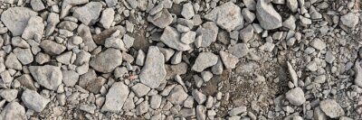 Tableau  Panoramic image. Gray gravel stones for the underground in road construction