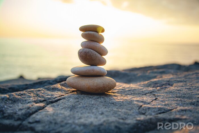 Tableau  Pierres ovales sur fond de soleil