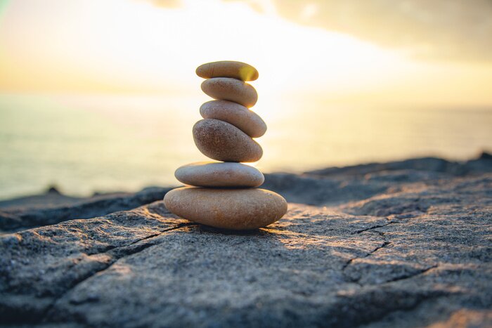 Tableau  Pierres ovales sur fond de soleil