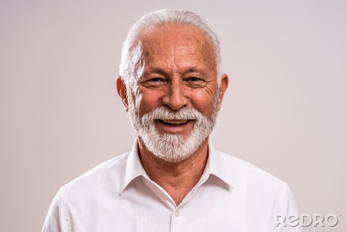 Tableau  Portrait of cheerful senior man who is looking at camera and smiling.