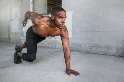 Tableau  Shirtless male african american athlete training in urban city concrete background, sprinter, runner, jogger, muscular toned build training for race