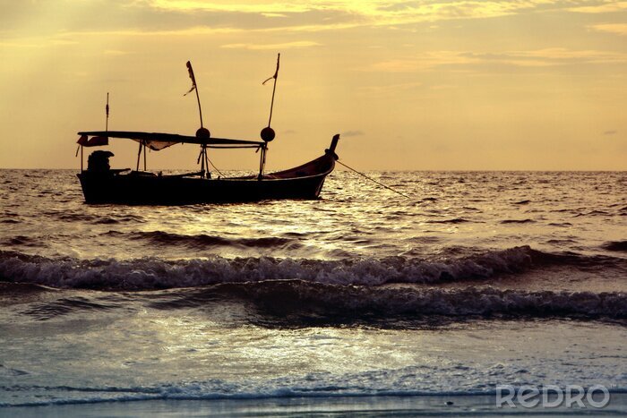 Tableau  silhouette de bateau au coucher du soleil