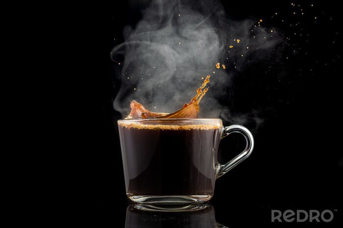 Tableau  splash and splatter from a piece of sugar in a mug with coffee on a black background