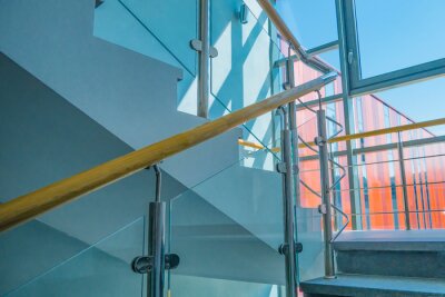 Tableau  Stainless steel, glass and wood railing.Fall Protection. modern design of handrail and staircase